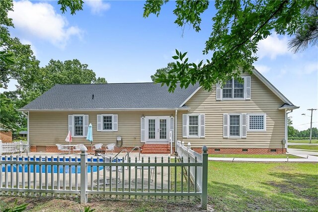 5201 Flynn Dr, Lumberton, NC 28360 - rear view of property featuring crawl space, french doors, entry steps, an outdoor pool, and a patio