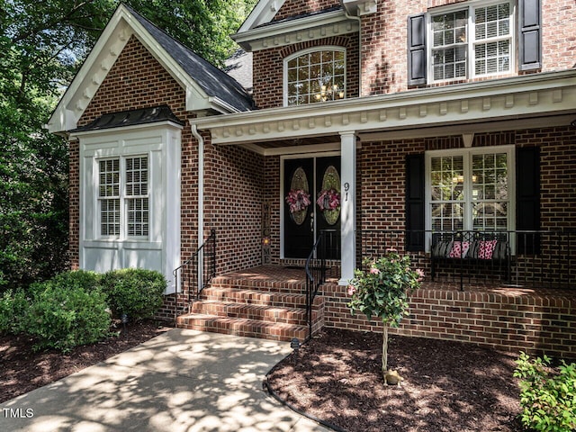91 E Walker Woods Ln, Clayton, NC 27527 - entrance to property featuring brick siding and covered porch
