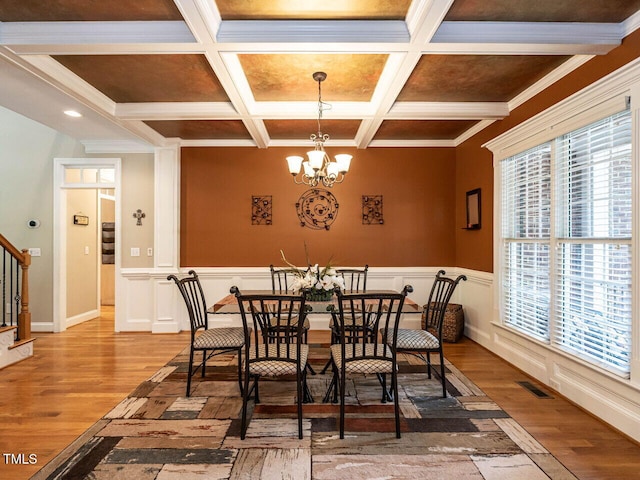 91 E Walker Woods Ln, Clayton, NC 27527 - dining room featuring stairs, coffered ceiling, a chandelier, wood finished floors, and beamed ceiling