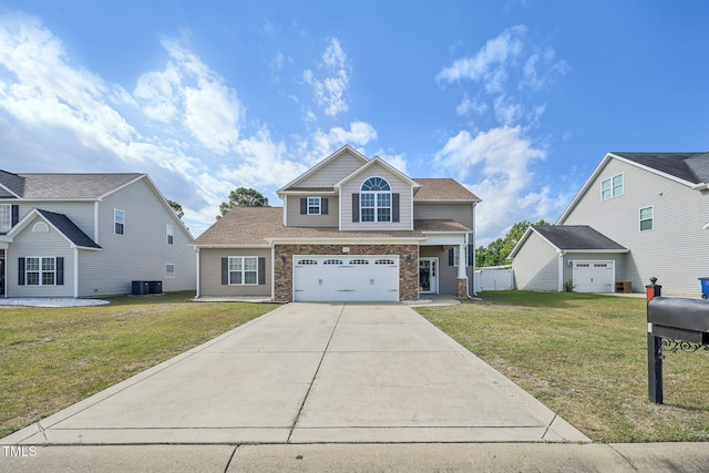 265 Wind Swept St, Raeford, NC 28376 - traditional-style home featuring driveway, a front yard, an attached garage, and a shingled roof