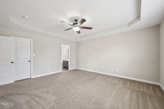 265 Wind Swept St, Raeford, NC 28376 - carpeted spare room featuring a raised ceiling, a ceiling fan, and baseboards