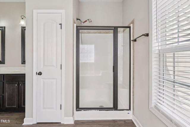 265 Wind Swept St, Raeford, NC 28376 - full bath with a stall shower, wood finished floors, vanity, and baseboards