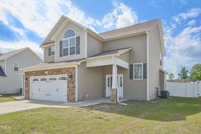 265 Wind Swept St, Raeford, NC 28376 - view of front of home featuring driveway, an attached garage, central air condition unit, and a shingled roof