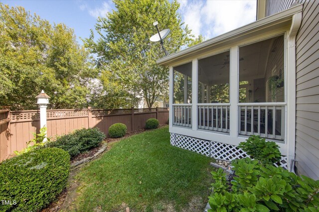 view of yard with a sunroom