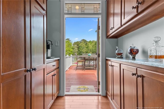 entryway with light wood-style floors