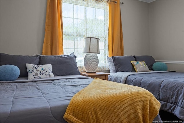 bedroom with crown molding