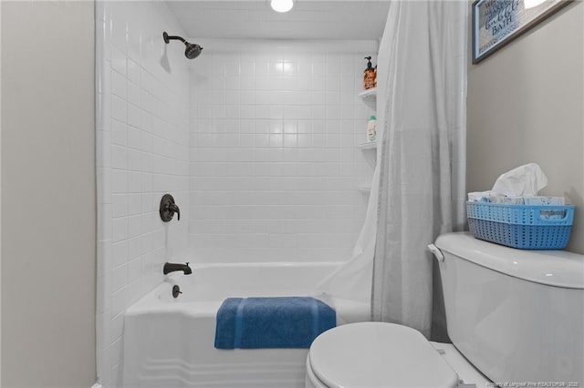 bathroom with toilet and shower / bath combo with shower curtain