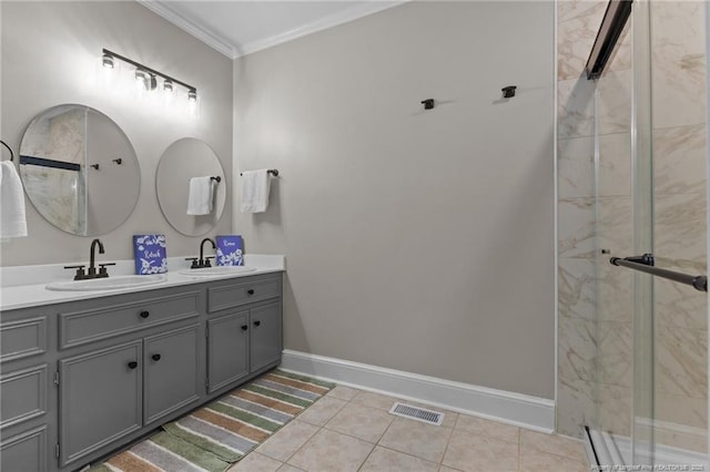 bathroom with a sink, crown molding, tiled shower, and visible vents