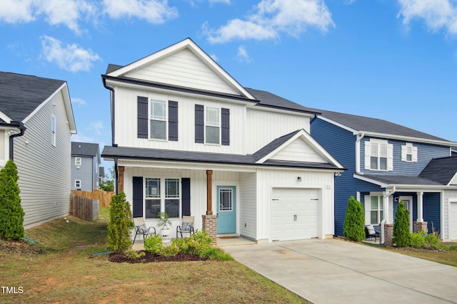 21 Diploma Dr, Clayton, NC 27520 - view of front of house featuring covered porch, board and batten siding, concrete driveway, and a garage