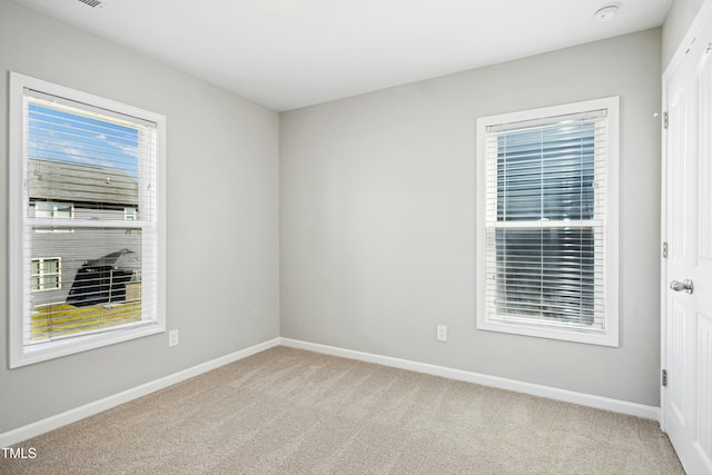 21 Diploma Dr, Clayton, NC 27520 - spare room featuring light colored carpet, baseboards, and a smoke detector
