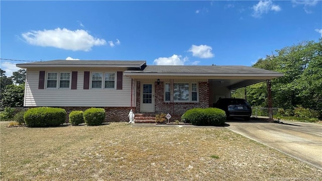 3412 Seven Mountain Dr, Fayetteville, NC 28306 - tri-level home with driveway, a carport, a front yard, and brick siding