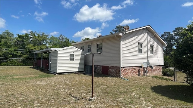 3412 Seven Mountain Dr, Fayetteville, NC 28306 - view of home's exterior with a shed, an outdoor structure, and central AC