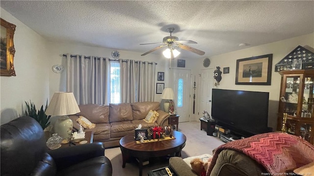 3412 Seven Mountain Dr, Fayetteville, NC 28306 - carpeted living area featuring ceiling fan and a textured ceiling