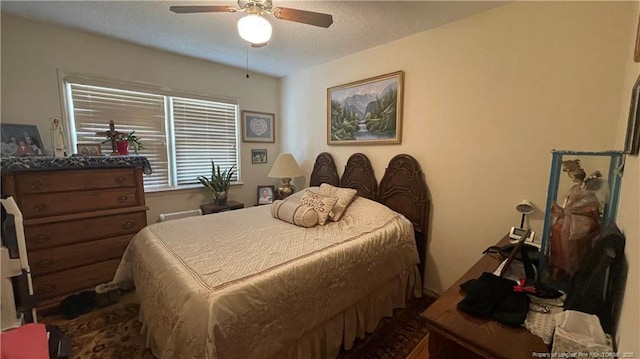 3412 Seven Mountain Dr, Fayetteville, NC 28306 - bedroom with ceiling fan and a textured ceiling