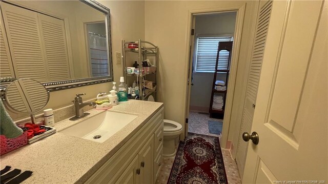 3412 Seven Mountain Dr, Fayetteville, NC 28306 - full bathroom with toilet and vanity