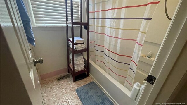 3412 Seven Mountain Dr, Fayetteville, NC 28306 - full bath featuring baseboards, shower / bathtub combination with curtain, and tile patterned flooring