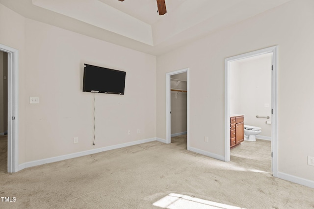 309 Coachmans Trl, Stem, NC 27581 - unfurnished bedroom with light carpet, a spacious closet, connected bathroom, and baseboards