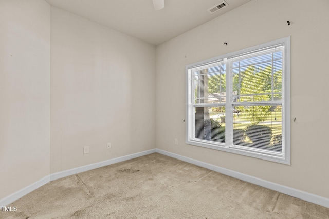 309 Coachmans Trl, Stem, NC 27581 - spare room featuring carpet floors, baseboards, and a ceiling fan