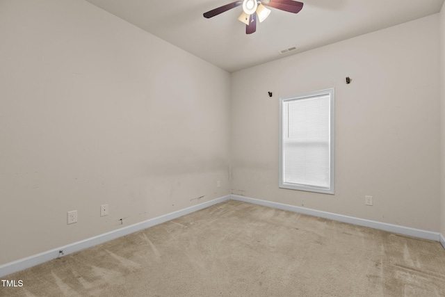 309 Coachmans Trl, Stem, NC 27581 - spare room featuring light colored carpet, baseboards, and ceiling fan