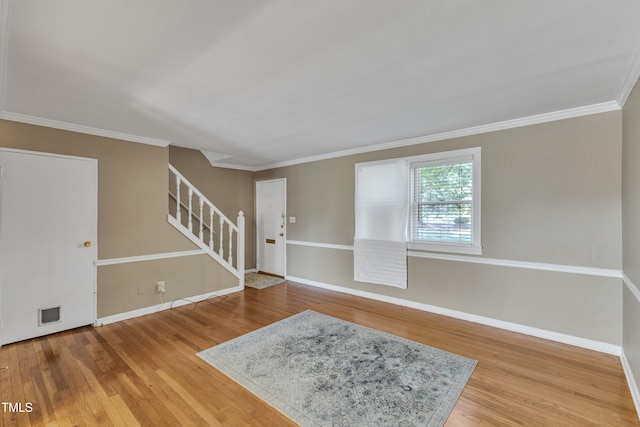 917 Saint Marys St, Raleigh, NC 27605 - entryway featuring stairway, wood finished floors, baseboards, and ornamental molding