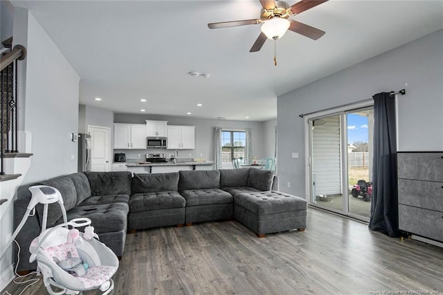 living area featuring wood finished floors, recessed lighting, and ceiling fan