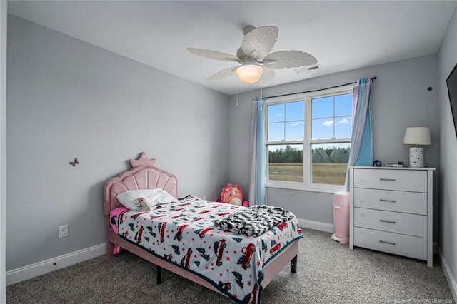 bedroom with light carpet, baseboards, and a ceiling fan