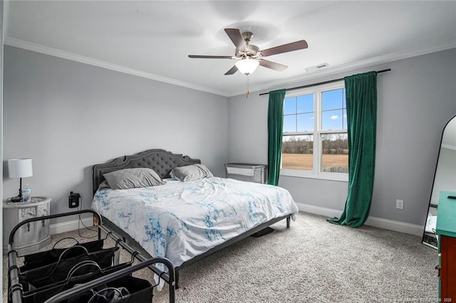 bedroom with baseboards, crown molding, carpet, and ceiling fan