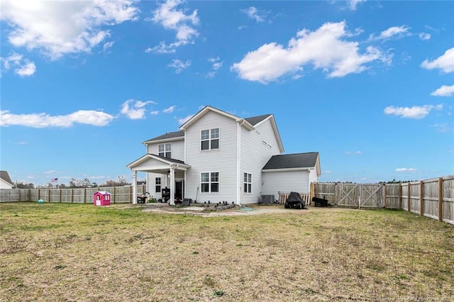 back of property featuring a patio and a gate