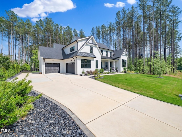 604 Dappled Pine Ave, Durham, NC 27713 - modern farmhouse style home with a standing seam roof, a front lawn, driveway, metal roof, and a garage