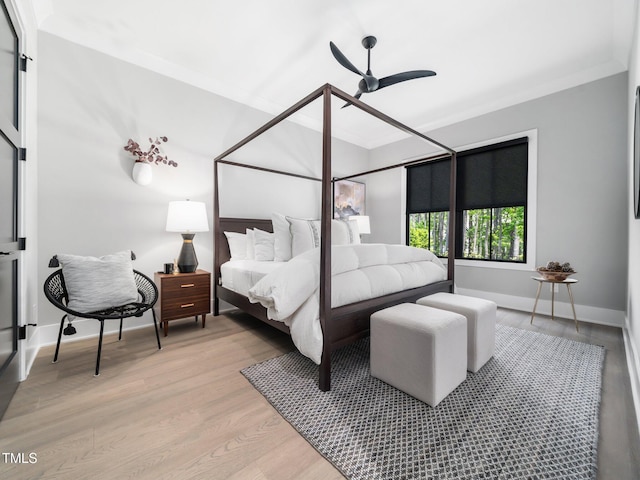 604 Dappled Pine Ave, Durham, NC 27713 - bedroom with ornamental molding, light wood-style floors, ceiling fan, and baseboards