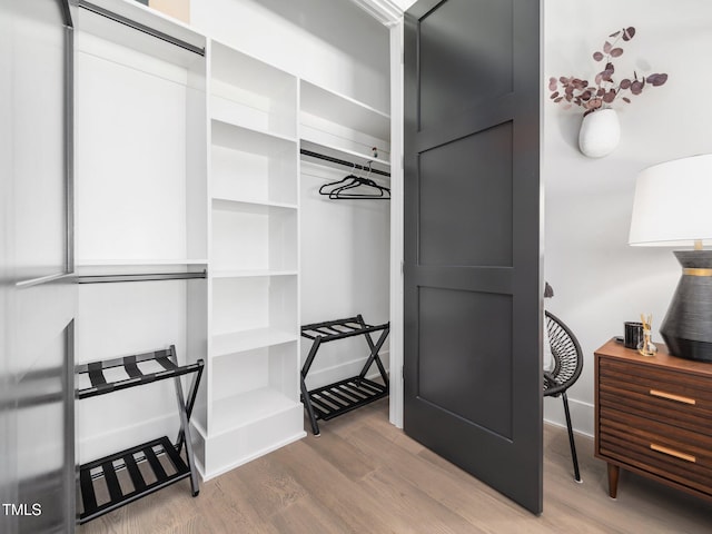 604 Dappled Pine Ave, Durham, NC 27713 - walk in closet with wood finished floors