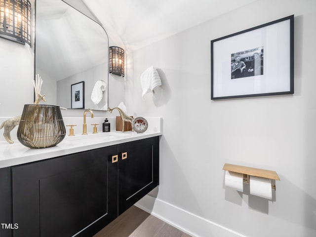 604 Dappled Pine Ave, Durham, NC 27713 - bathroom with vanity, wood finished floors, and baseboards
