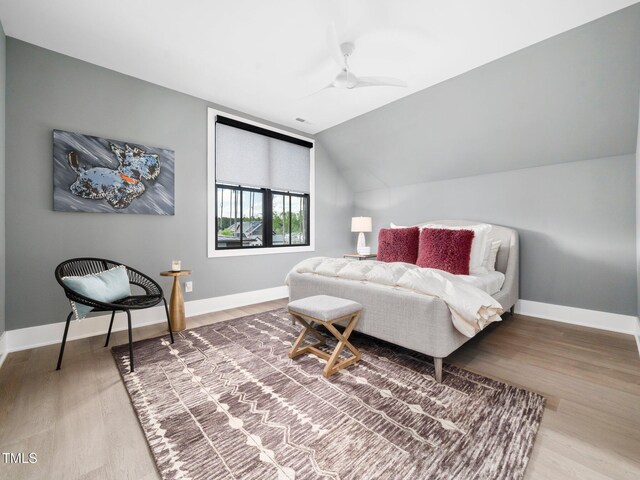 604 Dappled Pine Ave, Durham, NC 27713 - bedroom featuring wood finished floors, lofted ceiling, and baseboards