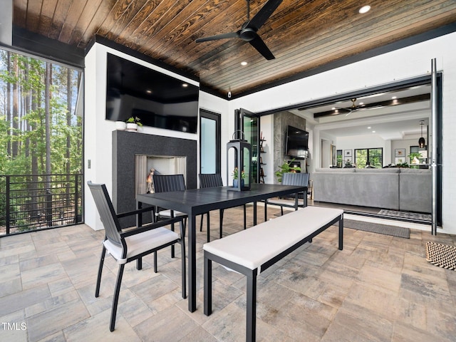 604 Dappled Pine Ave, Durham, NC 27713 - view of patio / terrace featuring outdoor dining space, a fireplace, and ceiling fan