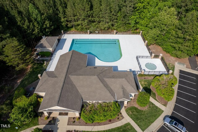 604 Dappled Pine Ave, Durham, NC 27713 - view of subject property featuring a pool and a forest