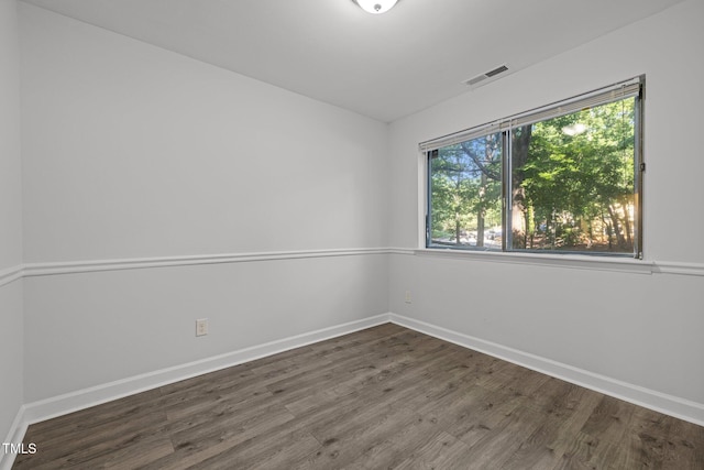 1131 Schaub Dr, Raleigh, NC 27606 - empty room with wood finished floors and baseboards