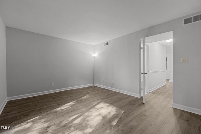 1131 Schaub Dr, Raleigh, NC 27606 - empty room featuring wood finished floors and baseboards