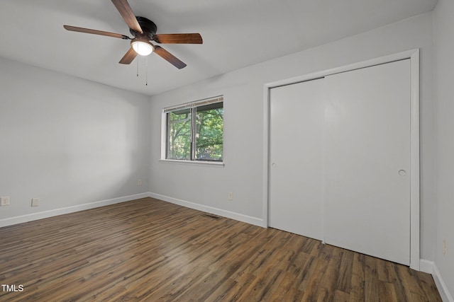 1131 Schaub Dr, Raleigh, NC 27606 - unfurnished bedroom with wood finished floors, baseboards, a closet, and ceiling fan