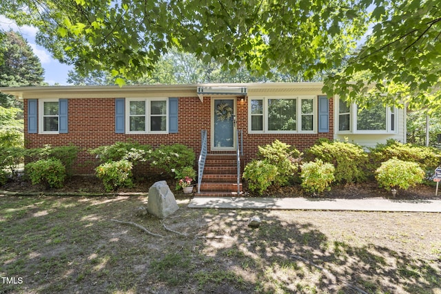 5517 Spring Rd, Raleigh, NC 27603 - single story home with brick siding and entry steps