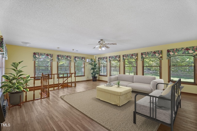 5517 Spring Rd, Raleigh, NC 27603 - sunroom / solarium featuring a textured ceiling, wood finished floors, baseboards, and a deck