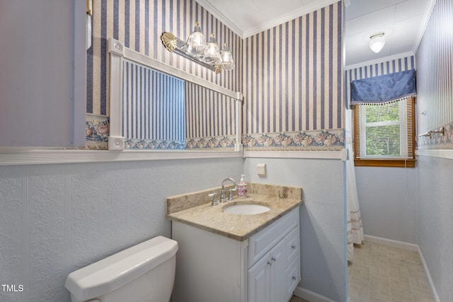 5517 Spring Rd, Raleigh, NC 27603 - full bath with crown molding, toilet, vanity, baseboards, and wallpapered walls
