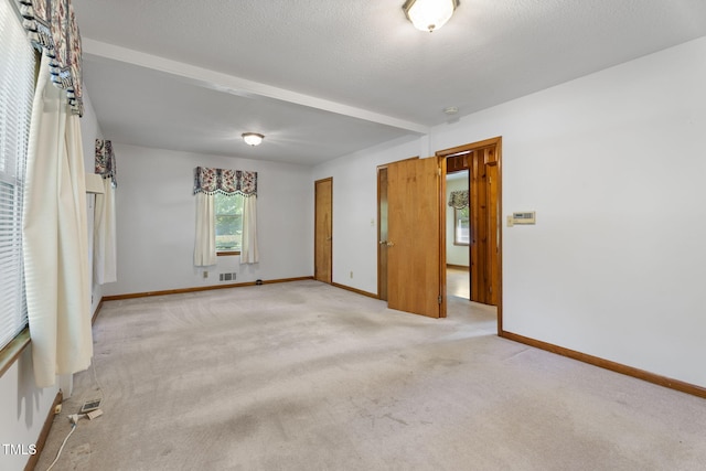 5517 Spring Rd, Raleigh, NC 27603 - unfurnished bedroom with baseboards and light carpet