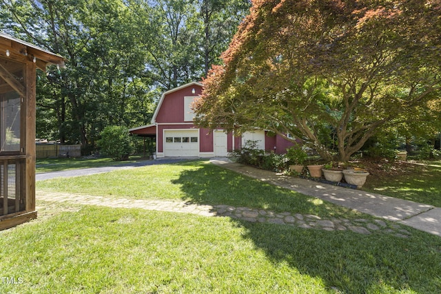 5517 Spring Rd, Raleigh, NC 27603 - view of front of house with driveway, an outdoor structure, a front yard, a barn, and a detached garage