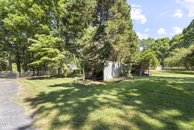 5517 Spring Rd, Raleigh, NC 27603 - view of yard featuring a shed and an outdoor structure