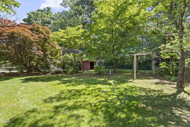 5517 Spring Rd, Raleigh, NC 27603 - view of grassy yard featuring an outbuilding
