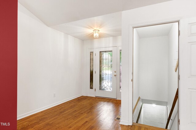 entrance foyer with wood finished floors and baseboards
