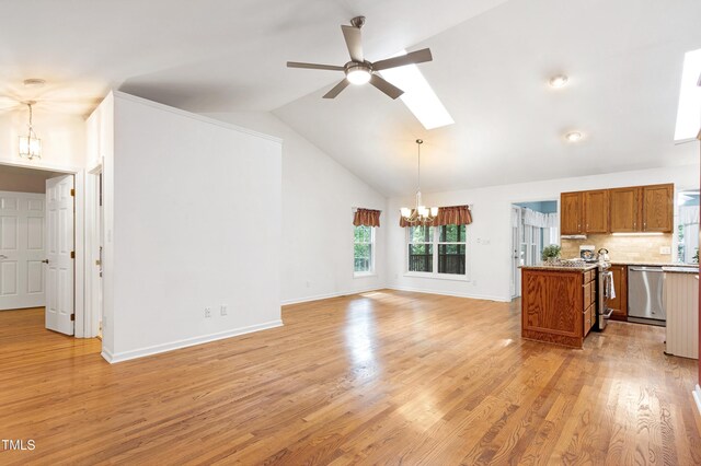 unfurnished living room featuring a chandelier, a ceiling fan, light wood-type flooring, baseboards, and high vaulted ceiling