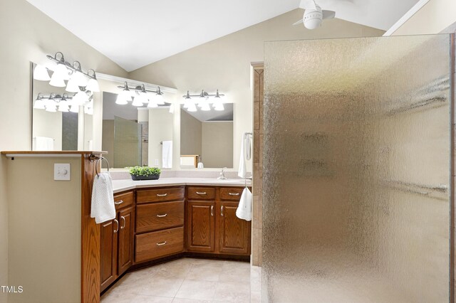 full bath with a walk in shower, ceiling fan, vaulted ceiling, tile patterned floors, and vanity