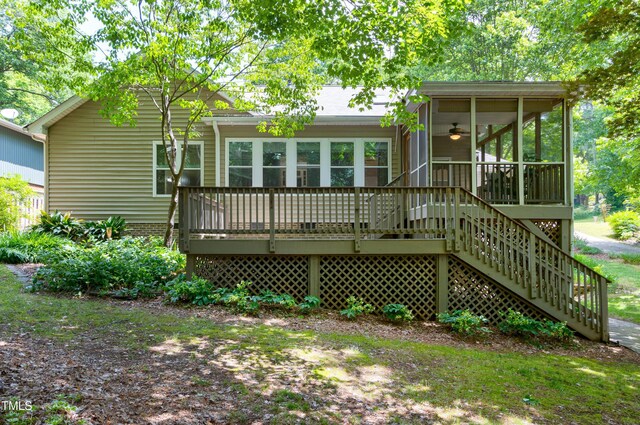 back of house with a sunroom, stairs, and a ceiling fan
