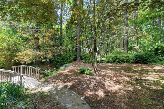view of yard featuring a view of trees